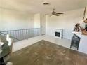 Bright living room with ceiling fan, faux fireplace and space for customization at , Las Vegas, NV 89119