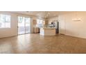 Open-concept living space with tile flooring and a modern kitchen island at 1012 Collingtree St, Las Vegas, NV 89145