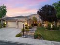Beautifully landscaped front yard with a stone walkway, manicured lawn, and a charming single-story home at 1016 Sable Mist Ct, Las Vegas, NV 89144