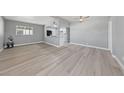 Open-concept living room features new floors, neutral paint, and a ceiling fan at 104 Stanford St, Las Vegas, NV 89107