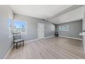 Bright living room features neutral paint, beamed ceilings and updated flooring at 104 Stanford St, Las Vegas, NV 89107