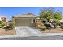 Single-story home with xeriscaped front yard, covered entry, and two-car garage at 1208 Neva Ranch Ave, North Las Vegas, NV 89081