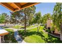 Scenic view of the green space featuring mature trees and walking paths at 1515 E Reno Ave # C207, Las Vegas, NV 89119
