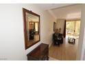 Living room leading to balcony, featuring hard wood floors and stylish decor at 230 E Flamingo Rd # 229, Las Vegas, NV 89169