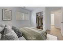 Cozy bedroom with ample natural light, closet, and neutral decor at 2431 Lilac Cove St, Las Vegas, NV 89135