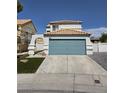 Charming two-story home featuring an attached two-car garage and a well-manicured lawn at 332 Dockside Ct, Las Vegas, NV 89145