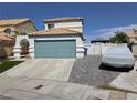 Charming two-story home featuring an attached two-car garage and a well-manicured lawn at 332 Dockside Ct, Las Vegas, NV 89145