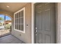 View of a grey-colored front door with window at 4016 Gaster Ave, North Las Vegas, NV 89081