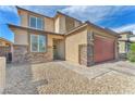 Close up of the front exterior showing a stone accent wall and brick-paved walkway at 4332 Stardusk Falls Ave, North Las Vegas, NV 89084