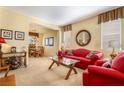 Cozy living room with neutral walls, plush carpeting and classic furniture pieces at 532 Kavanagh Pl, Las Vegas, NV 89123