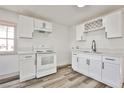 Bright kitchen with white cabinets, modern countertops, and stainless steel appliances at 603 W Adams Ave, Las Vegas, NV 89106