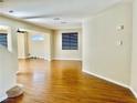 Bright and airy living room features sleek floors, neutral walls, and plenty of natural light, creating a warm and inviting space at 6043 Cape Clairmont Ct, North Las Vegas, NV 89031