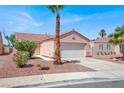 Charming single-story home with a two-car garage and desert landscaping in a sunny neighborhood at 612 Moontide Ct, Henderson, NV 89011