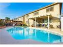 Sparkling pool and covered patio, perfect for outdoor entertaining and enjoying the backyard oasis at 7317 Wild Roar Ave, Las Vegas, NV 89129