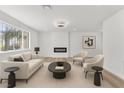 Comfortable living room with modern fireplace, neutral furnishings, and ample natural light at 747 Greenbriar Townhouse Way, Las Vegas, NV 89121