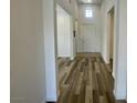 Bright hallway features hard surface flooring and leads to other rooms at 8550 Lost Pony St, Las Vegas, NV 89148