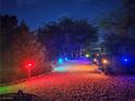 Gravel driveway with colored lights on pathway leading to a property entrance at 871 Buol Rd, Pahrump, NV 89048