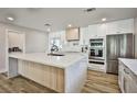Spacious kitchen features a large center island, stainless steel appliances, and modern finishes at 9340 W Washburn Rd, Las Vegas, NV 89149