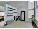 Spacious entryway with high ceilings, a decorative mirror, and modern shelving at 1013 Corsica Ln, Las Vegas, NV 89144