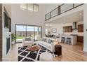Open concept living room with kitchen access and outdoor views at 182 Robledo St, Las Vegas, NV 89138
