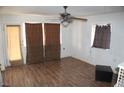 This living room showcases wood flooring, a ceiling fan, and neutral wall colors at 192 W Alma Ave, Overton, NV 89040