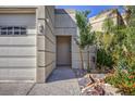 Welcoming front entrance with tasteful landscaping, rock features, and neutral exterior colors at 2017 Slow Wind St, Las Vegas, NV 89134