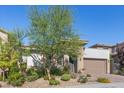 Charming single-Gathering home featuring desert landscaping and a two car garage at 251 Castellari Dr, Las Vegas, NV 89138