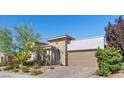Charming single-Gathering home featuring desert landscaping and a two car garage at 251 Castellari Dr, Las Vegas, NV 89138
