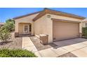 Attractive single-story home with a two-car garage, desert landscaping, and a covered front entry at 2535 Leighton Ave, Henderson, NV 89052