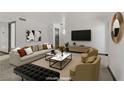 Comfortable living room featuring plush seating, modern art, and a contemporary entertainment center at 2963 Juniper Hills Blvd # 104, Las Vegas, NV 89142
