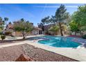 Community pool area with clean, inviting waters, surrounded by mature trees and landscaping at 2963 Juniper Hills Blvd # 104, Las Vegas, NV 89142