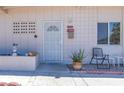 Close-up of the front entrance with security door, decorative details, and potted plant at 3212 Osage Ave, Las Vegas, NV 89101