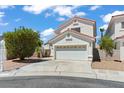 Lovely two-story house featuring a two-car garage and landscaped front yard in a sunny setting at 3632 Julia Waldene Ct, Las Vegas, NV 89129