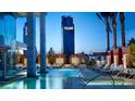 Inviting outdoor pool area with lounge chairs, palm trees, and views of the Palms building at 4381 W Flamingo Rd # 1905, Las Vegas, NV 89103