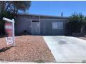 Exterior view of home with gravel yard, concrete driveway, and sign indicating a pool and casita at 5178 Wilbur St, Las Vegas, NV 89119