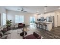 Bright, open-concept living room and kitchen with modern finishes and stainless steel appliances at 545 Thea St # 1315, Henderson, NV 89052