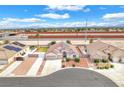 An aerial view of a single-story stucco home with a two car garage and desert landscaping at 5505 Verbena Creek Ct, Las Vegas, NV 89131