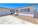 The exterior is crisp, white, single-story and features brick and concrete at 6204 Parsifal Pl, Las Vegas, NV 89107