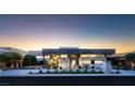 Contemporary home with unique design elements and manicured landscaping creating an inviting curb appeal at 671 Scenic Rim Dr, Henderson, NV 89012