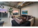 Spacious living room featuring a large sectional sofa, modern decor, and an industrial style ceiling at 900 Las Vegas Blvd # 912, Las Vegas, NV 89101