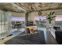 Open floor plan with dining area, office, and living room featuring cityscape views at 900 Las Vegas Blvd # 912, Las Vegas, NV 89101