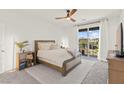 Serene bedroom with balcony access, neutral tones, and soft natural light creating a relaxing atmosphere at 9743 Mojave Mountain St, Las Vegas, NV 89166