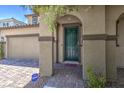 Close-up of front entry, showing paver walkway, and front door at 9785 W Meranto Ave, Las Vegas, NV 89178