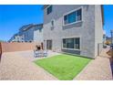 The backyard features low maintenance landscaping, a cozy patio, and a built in gas grill at 10435 Rose Palisade St, Las Vegas, NV 89141
