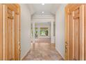 Grand foyer with tile flooring, high ceilings, and a view into the bright and open living spaces at 10548 Findlay Ave, Las Vegas, NV 89134