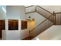 View of wooden staircase with access to kitchen at 11404 Belmont Lake Dr # 103, Las Vegas, NV 89135