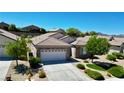 Charming single-story home featuring a two-car garage, stone facade, and desert-friendly landscaping at 2535 Jada Dr, Henderson, NV 89044