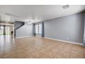Spacious living room with tile flooring, recessed lights, and ample natural light at 262 Calvino Ave, Las Vegas, NV 89183