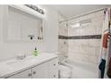 Clean bathroom with tile shower and tub, marble countertops, and ample lighting at 3208 Alcoa Ave, Las Vegas, NV 89102