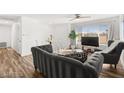 Bright living room featuring hardwood floors, large windows, and modern furnishings at 3208 Alcoa Ave, Las Vegas, NV 89102